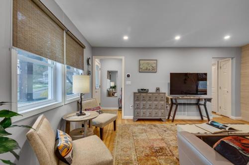 a living room with a couch and a table at 2BR DOG-Friendly Apt in 2-Fam Home - Comfy Retreat in Boston