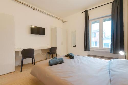 Postel nebo postele na pokoji v ubytování Confortevole Stanza 6 con bagno privato Stazione