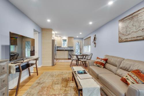a living room with a couch and a table at 2BR DOG-Friendly Apt in 2-Fam Home - Comfy Retreat in Boston