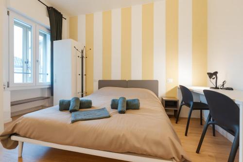 a bedroom with a bed with two pillows on it at BonB 127 c7-c8 in Padova