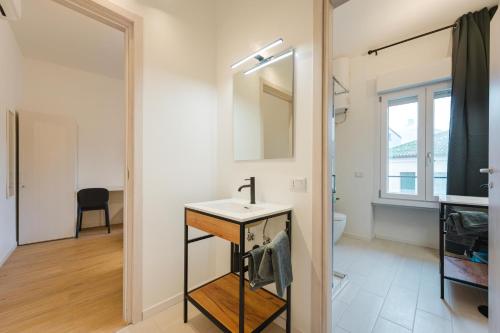 a bathroom with a sink and a mirror at BonB 127 c7-c8 in Padova