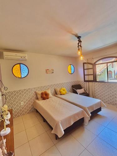 En eller flere senge i et værelse på Refúgio Amor de Mãe