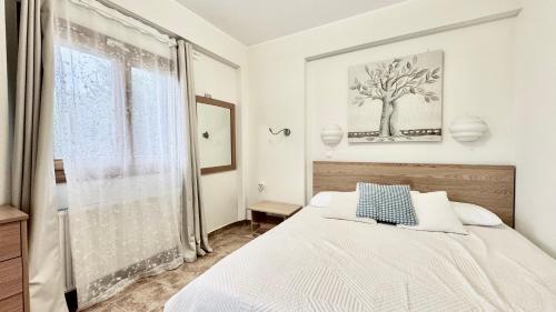 Ένα ή περισσότερα κρεβάτια σε δωμάτιο στο Kriopigi Forest Residence by Granari Rentals