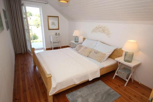 Postel nebo postele na pokoji v ubytování Ferienhaus Düne