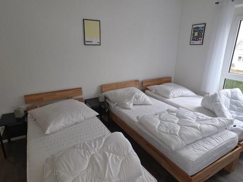 Ένα ή περισσότερα κρεβάτια σε δωμάτιο στο Nestwerk Solide L16-01