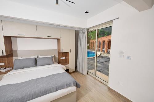 Ένα ή περισσότερα κρεβάτια σε δωμάτιο στο Settle Inn Mirage Boutique Hotel