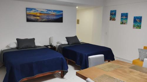 Postel nebo postele na pokoji v ubytování Hermosa Suite a Pie de Playa en Acapulco