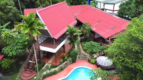 an aerial view of a house with a swimming pool at Kantiang Beach Apartments in Ban Ru Yai