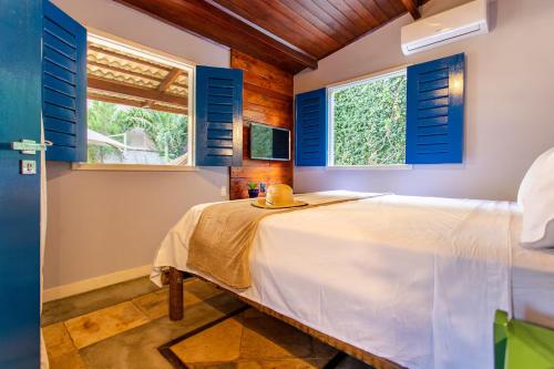 Ένα ή περισσότερα κρεβάτια σε δωμάτιο στο Quarto em Villa Blu Jeri