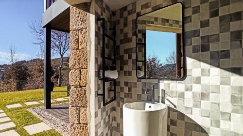 a bathroom with a sink and a mirror at Quinta da Lameirinha Douro, Boutique Home in Baião