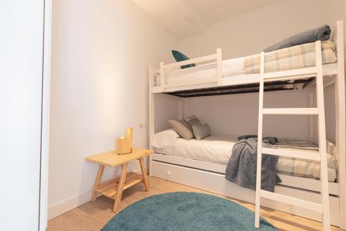 Ένα ή περισσότερα κρεβάτια σε δωμάτιο στο Apartamento en la mejor zona de la Sierra junto a los remontes Reformado en 2021