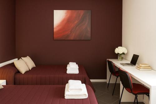 Ένα ή περισσότερα κρεβάτια σε δωμάτιο στο Residenze Italia