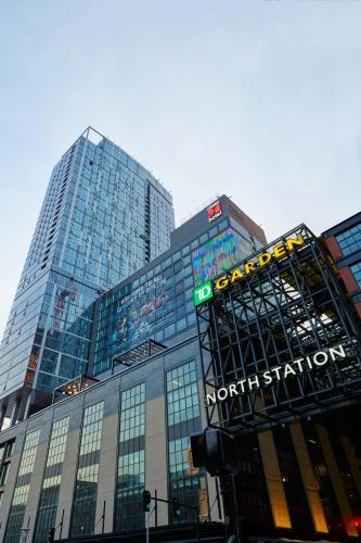 a tall building with a sign on the front of it at citizenM Boston North Station in Boston