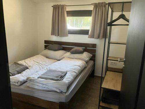 Ένα ή περισσότερα κρεβάτια σε δωμάτιο στο Rác Relax