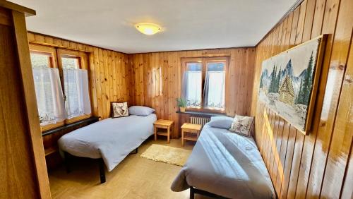 En eller flere senge i et værelse på 360 Viewpoint Alpine Apartments "Mont Blanc"