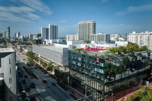 an aerial view of a city with tall buildings at citizenM Miami South Beach in Miami Beach