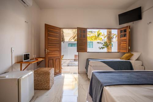 En eller flere senge i et værelse på Perfect Day Home