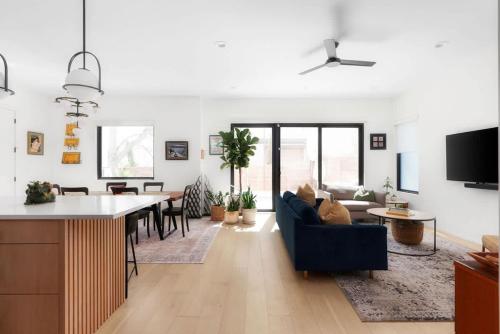 a kitchen and living room with a couch and a table at Central Austin Oasis with Pool - Sleeps 9 in Austin