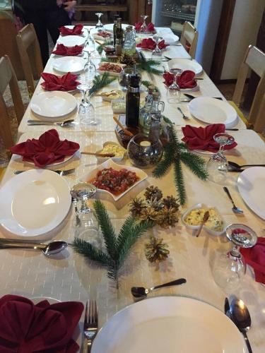 a long table with plates of food on it at Hosteria Rayen in La Junta