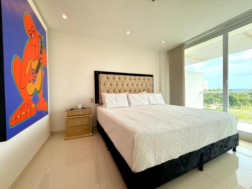 Postel nebo postele na pokoji v ubytování Karibmed Cartagena