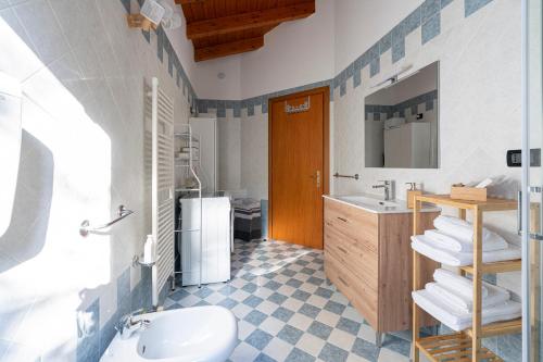 a bathroom with a sink and a toilet at Green Hill apartment in Salò