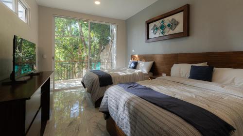 Ένα ή περισσότερα κρεβάτια σε δωμάτιο στο Hotel Bernardino