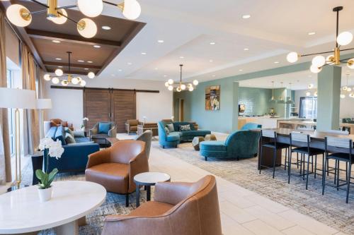 a lobby of a hotel with couches and chairs at TownePlace Suites Dayton Beavercreek in Beavercreek