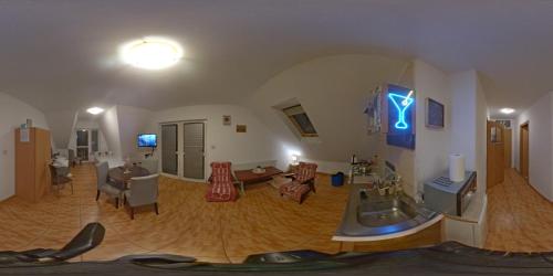 a room with a living room and a dining room at Tanie Noclegi Krysia Falsztyn in Falsztyn