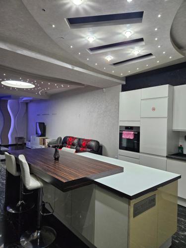a kitchen with a large island in a room at Schönbrunn Apartments in Vienna