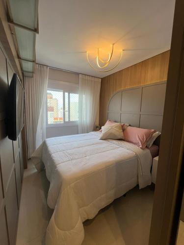 Ένα ή περισσότερα κρεβάτια σε δωμάτιο στο Edificio Premium 2 dormitórios