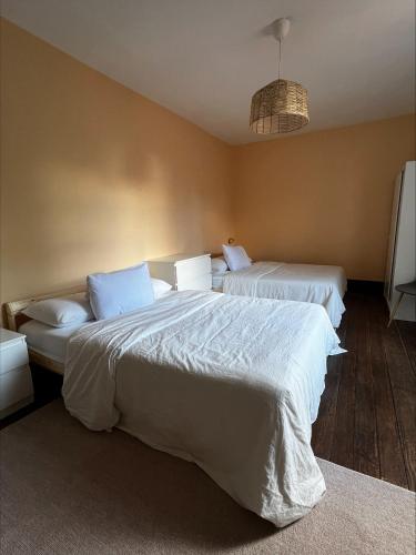 Ένα ή περισσότερα κρεβάτια σε δωμάτιο στο Miquinhas Norte