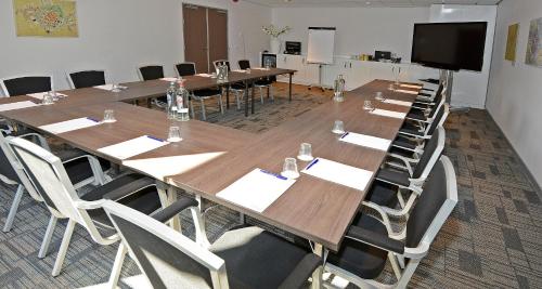 a large conference room with a long table and chairs at Best Western City Hotel Woerden in Woerden