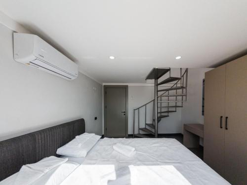 Ένα ή περισσότερα κρεβάτια σε δωμάτιο στο Dorado Suit