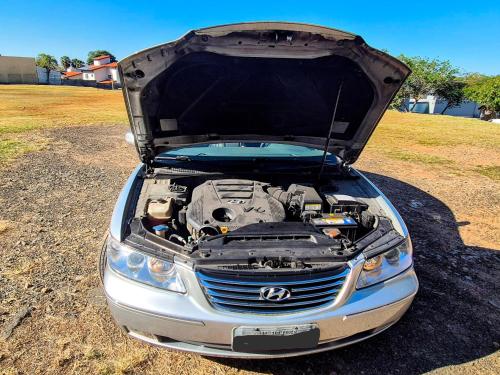 a car with its hood open with its engine at Sao Roque Park Car in São Roque