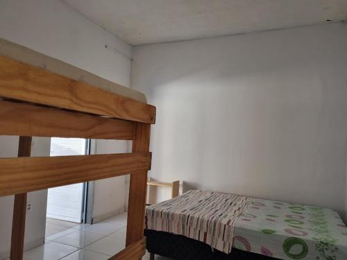 a bedroom with a bunk bed in a room at Casa Petit Canoa Quebrada in Aracati