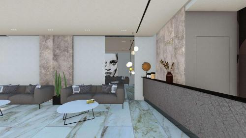 een woonkamer met banken en een tafel bij Hotel Select in Tirana