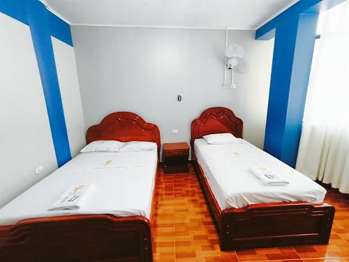 Ένα ή περισσότερα κρεβάτια σε δωμάτιο στο Horus Suite Hotel