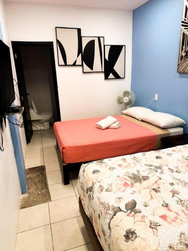 En eller flere senge i et værelse på Habitación Confortable en el Corazón de GDL