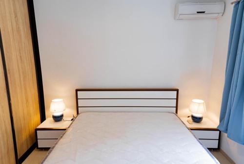 Ένα ή περισσότερα κρεβάτια σε δωμάτιο στο Hei Tiare Apartment