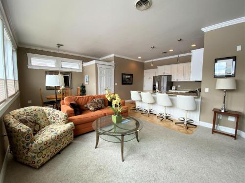 a living room with a couch and a table at Pier Harbor #1 in Saint Ignace