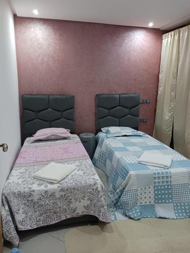 Ένα ή περισσότερα κρεβάτια σε δωμάτιο στο Residen NIZAR