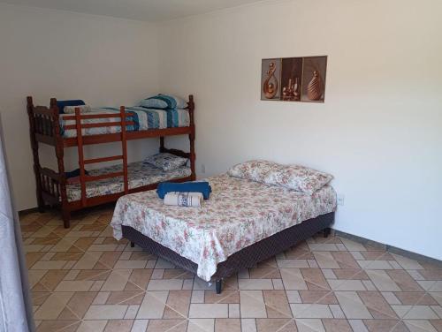 En eller flere senge i et værelse på Vista Montanha Sagrada