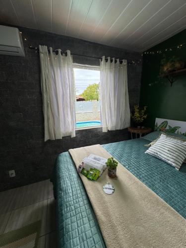 Ένα ή περισσότερα κρεβάτια σε δωμάτιο στο Suíte Floresta - Pousada Castelo do Luar