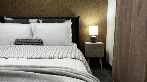 Ένα ή περισσότερα κρεβάτια σε δωμάτιο στο Executive Apartment Escazú