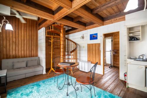 a kitchen and living room with a table and chairs at AK Resort ISHIGAKI in Ishigaki Island