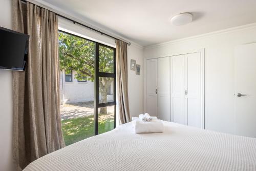 Ένα ή περισσότερα κρεβάτια σε δωμάτιο στο Pembroke Villa