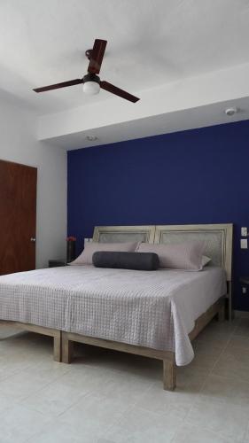 Ένα ή περισσότερα κρεβάτια σε δωμάτιο στο Condominio La Parota