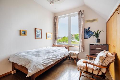 Postel nebo postele na pokoji v ubytování Sapporoの実家 B&B Yoshida