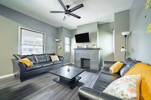a living room with a couch and a fireplace at Little Italy Gem Close to CWRU, Cleveland Clinic & Top Restaurants w King Bed in Cleveland