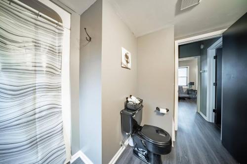 a bathroom with a toilet in a room at Little Italy Gem Close to CWRU, Cleveland Clinic & Top Restaurants w King Bed in Cleveland